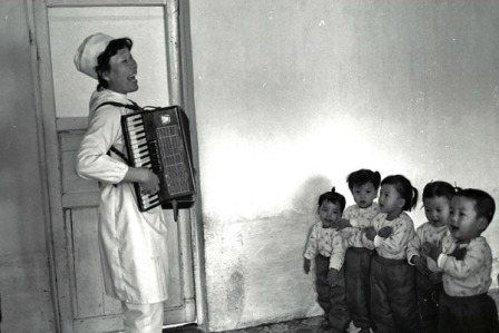 Abandoned, non-defective children get to listen to Accordian music in an orphanage in North Korea